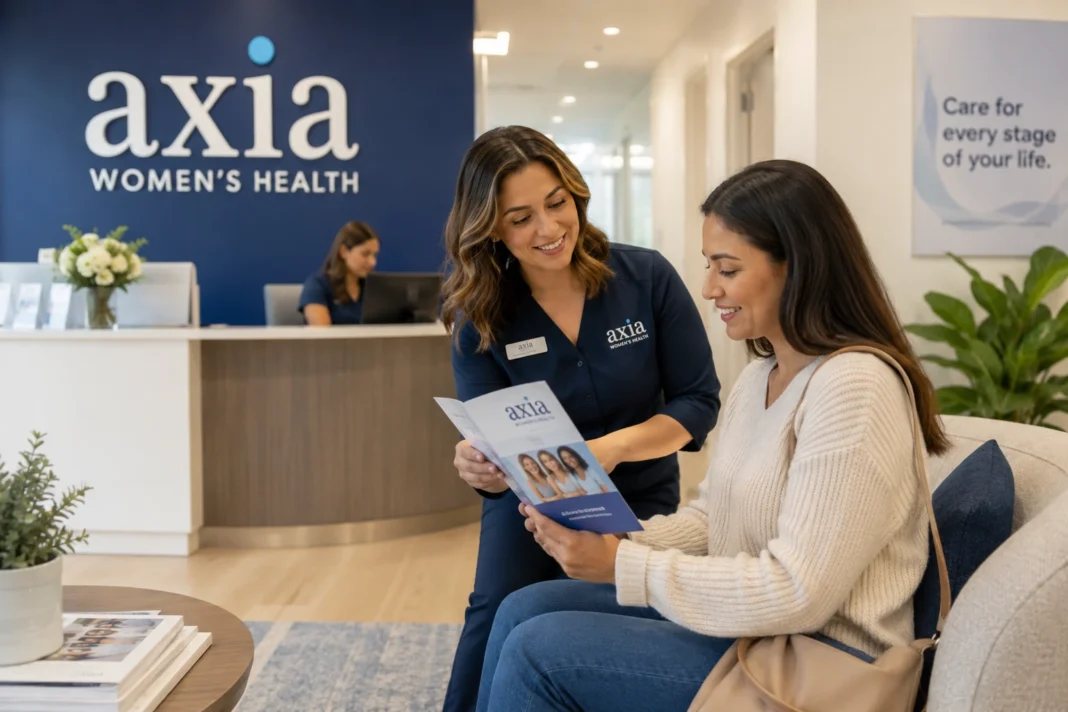 Axia Women’s Health Clinic and Patient Care Guide Patient receiving guidance from an Axia Women’s Health staff member inside a modern women’s health clinic reception area.